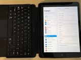 two laptops sitting next to each other on a table