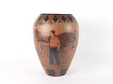 a vase that has a picture of a man on it