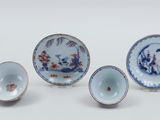 three small blue and white dishes and a small bowl and saucer