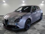 a picture of a silver car parked in a showroom