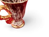 an image of a red and gold cup on a white background