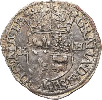 une pièce d'argent surmontée d'une couronne