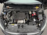 a car with its hood open and the engine in the trunk