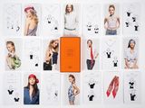 a lot of cards that have a picture of women ' s clothes on them