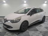 the white car is parked on a checkered floor in the garage