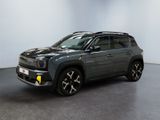 the grey jeep compass is parked in a room with a white wall