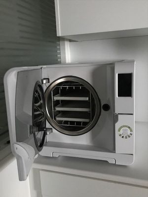 a white microwave with a fan on top of it