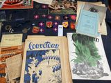 a table with a lot of old books and other items on it