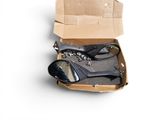 a box with a pair of scissors and other items in it