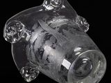 a clear glass object with a camera on top of it