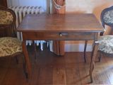 a small table and two chairs in a room