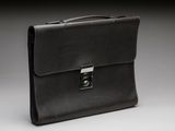 a black briefcase sitting on top of a white table