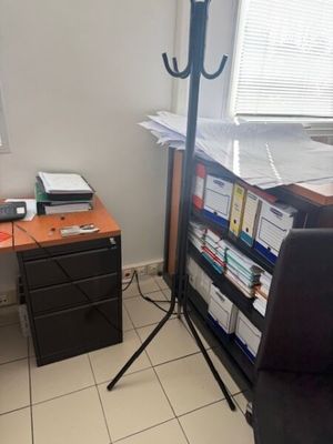 a desk with a chair and a computer on it