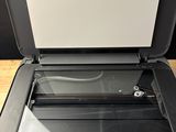 an open printer sitting on top of a wooden table