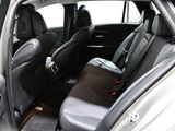the back seats of a car are empty in a parking lot