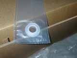 a cardboard box with a roll of tape on top of it