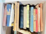 a box full of books sitting on a table