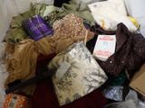 a box full of clothes and a pair of scissors