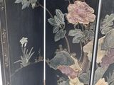 two panels with flowers and birds painted on them