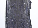 the back of a dress with sequins and beads on it