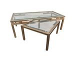 two tables with glass tops and gold metal legs