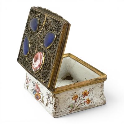 a white box with blue and pink flowers on it