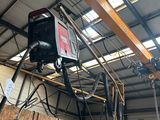 a crane that is hanging from the ceiling of a building