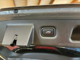 a close up of a car door with a remote control