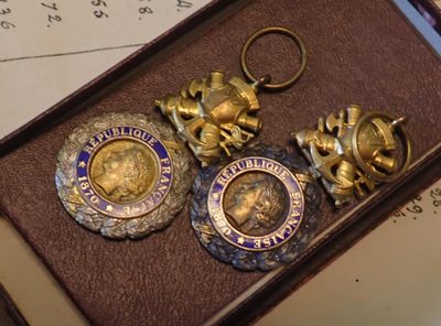 a box that has some gold and silver items inside of it