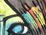 a painting of a woman ' s face on a piece of paper
