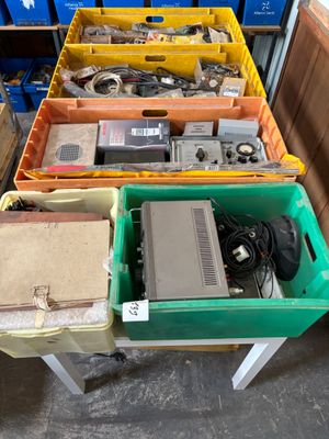 many different types of electronic equipment in the bins