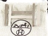 a picture of a tie bar with a picture of a horse and rider on it