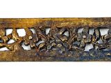 a metal plaque with a design of birds and flowers on it