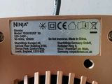 an image of a close up of a metal device with wires