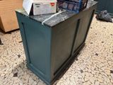 a counter that has a box of food on top of it