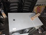 many chairs and a table with a computer on top of it