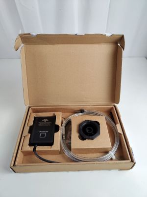 a box with a camera inside of it on a table