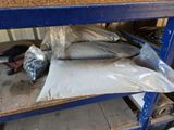 a pile of bags of sand sitting on a shelf