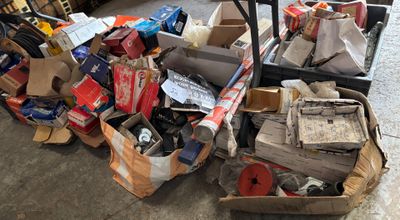 a pile of boxes and other items on the floor