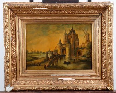 an oil painting of a castle in a golden frame on a table
