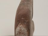 a wooden object that is sitting on a white surface