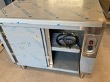 an image of a stainless steel kitchen island with a stove