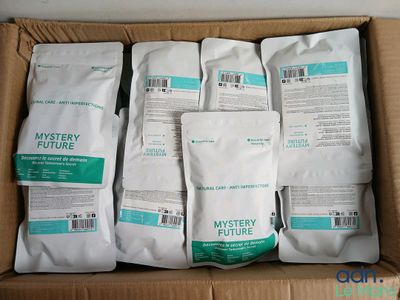 six bags of mystery future coffee sit in a cardboard box
