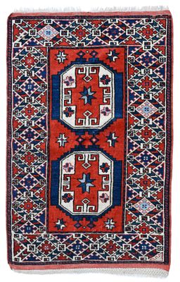 a red, blue and white rug with geometric design