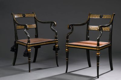 pair of black and gold painted chairs with wooden seat and back
