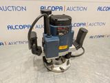 a blue and black machine sitting on top of a table