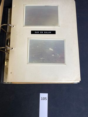 a binder with two photos on it and a sticker on the cover