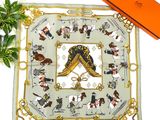 a square scarf with a picture of a man and a woman on horseback