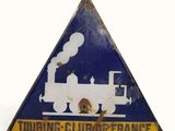 un panneau triangulaire sur lequel figure un train