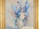 painting of flowers in a vase on a table in a gold frame